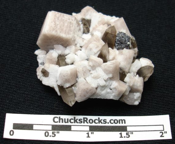Microcline, smoky quartz, albite, and hematite pseudomorph