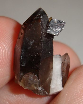 Smoky quartz, microcline, and hematite pseudomorph