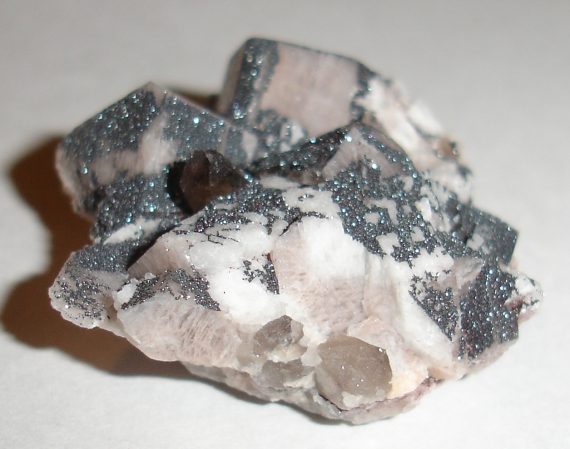 Microcline, albite, smoky quartz, and specular hematite