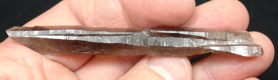 Long, tabular smoky quartz crystal