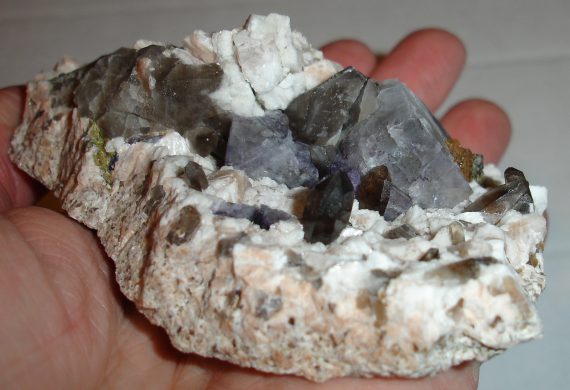 Fluorite, smoky quartz, microcline, and albite on matrix