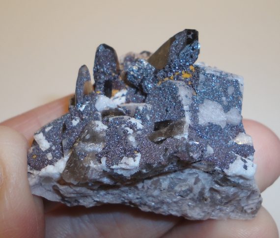 Smoky quartz, microcline (Manebach twin), hematite pseudomorph, and specular hematite