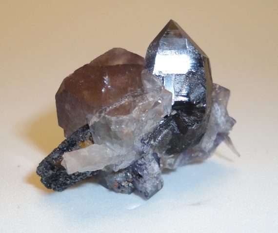 Fluorite, smoky quartz, and hematite pseudomorph.