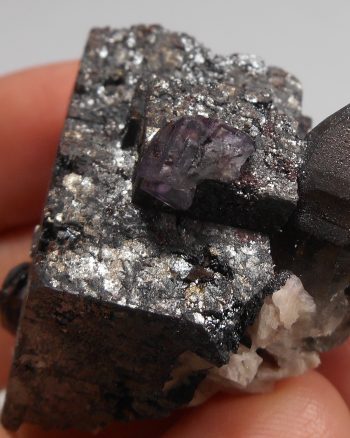 Smoky quartz, fluorite, and hematite pseudomorph