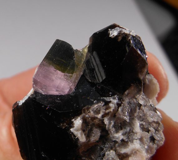 Tourmaline crystal with lavender/pink caps, with smoky quartz