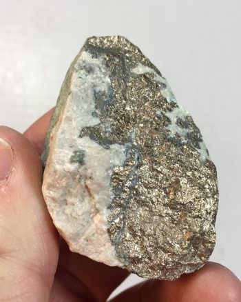 Massive nickeline specimen with minor annabergite