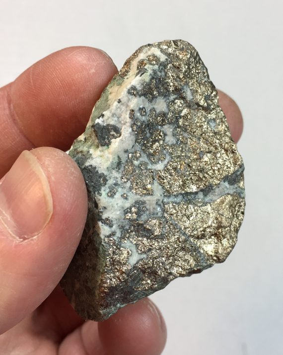 Massive nickeline specimen with minor annabergite
