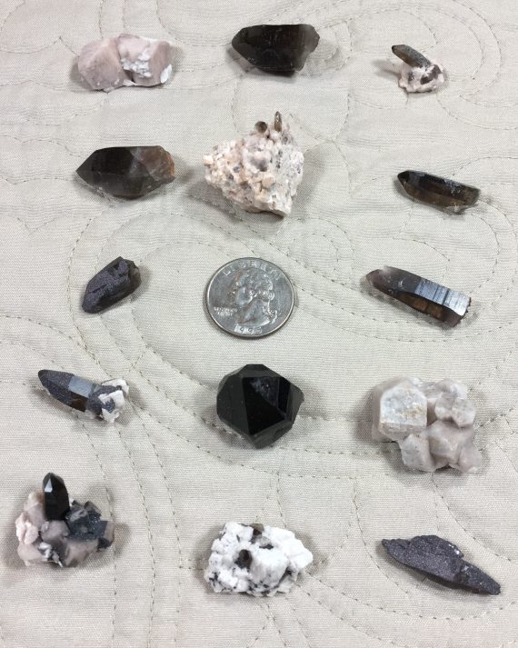 smoky quartz, microcline, albite, and specular hematite