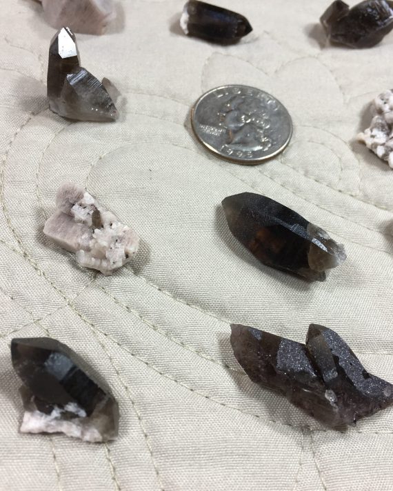 Collection of 14 thumbnail-sized specimens – smoky quartz, microcline, albite, and specular hematite