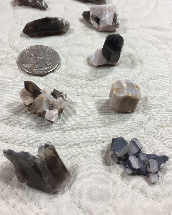 Collection of 14 thumbnail-sized specimens – smoky quartz, microcline, albite, and specular hematite