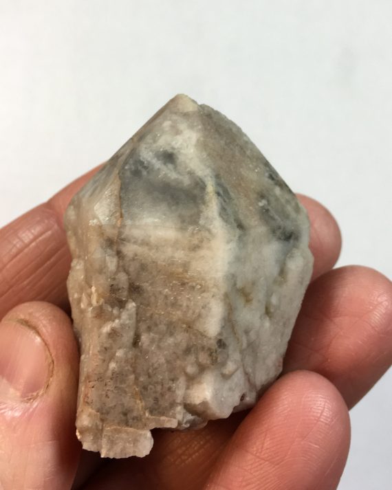 Smoky quartz crystal with secondary milky quartz overgrowth