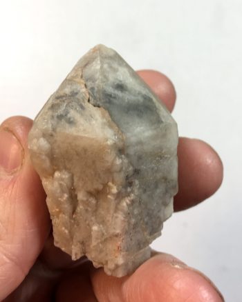Smoky quartz crystal with secondary milky quartz overgrowth