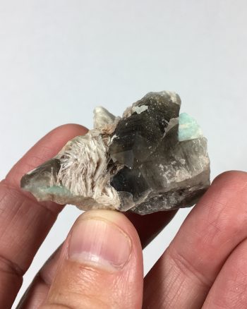 Amazonite, smoky quartz, and clevelandite on matrix