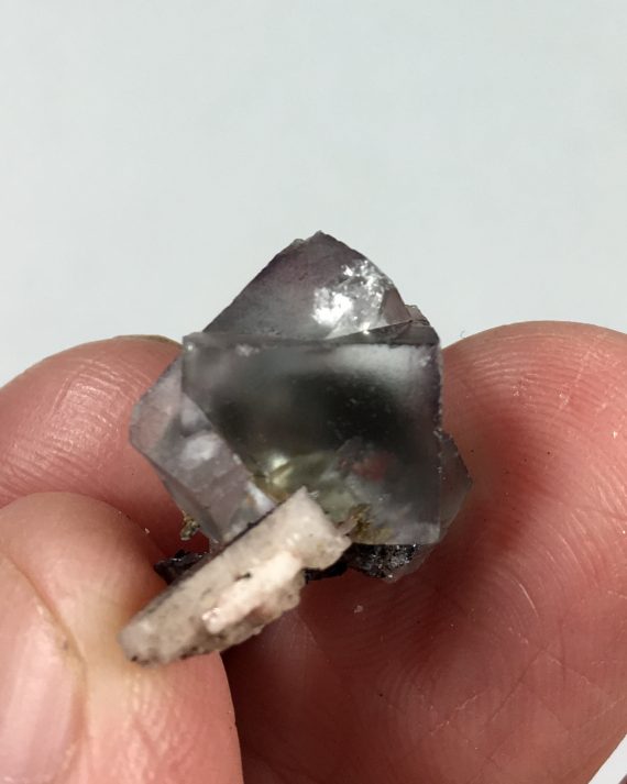 Fluorite, hematite after siderite pseudomorph, and microcline