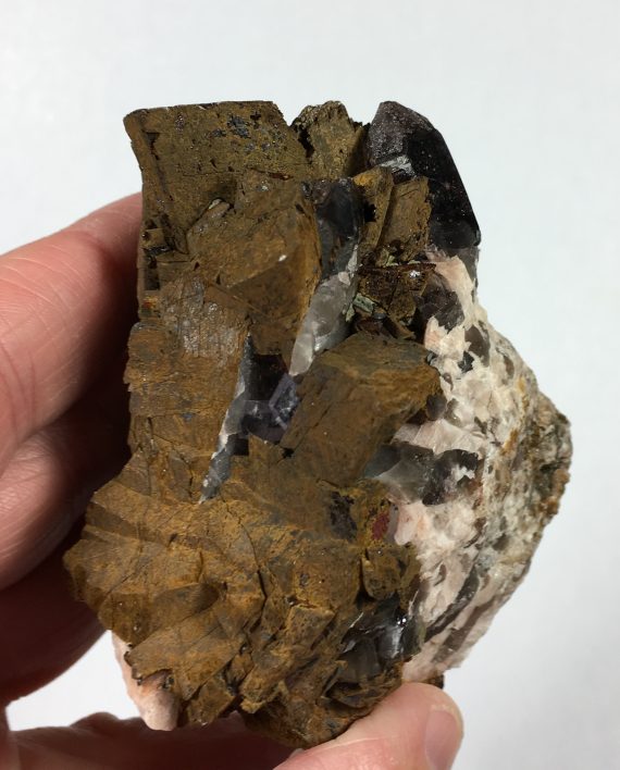 Limonite pseudomorph (after siderite?), smoky quartz, and fluorite