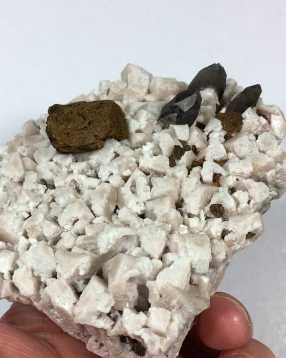 smoky quartz, microcline, albite, and limonite pseudomorph