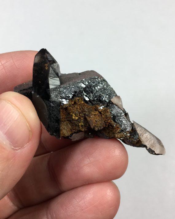Hematite pseudomorph (after siderite?) and smoky quartz