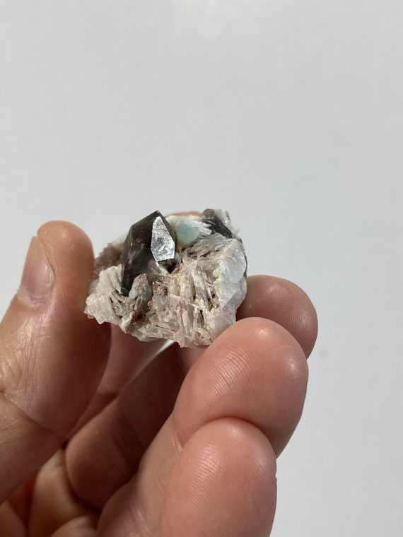 Smoky quartz, clevelandite, and small amazonite crystals