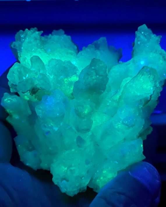 calcite and aragonite specimen, fluoresces bright greences bright green