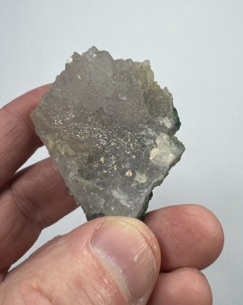 Very light purple quartz on green matrix.